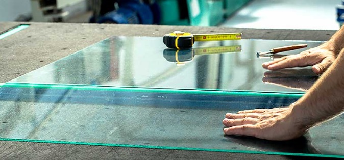 Glass sheet being measured and prepared for cutting to size